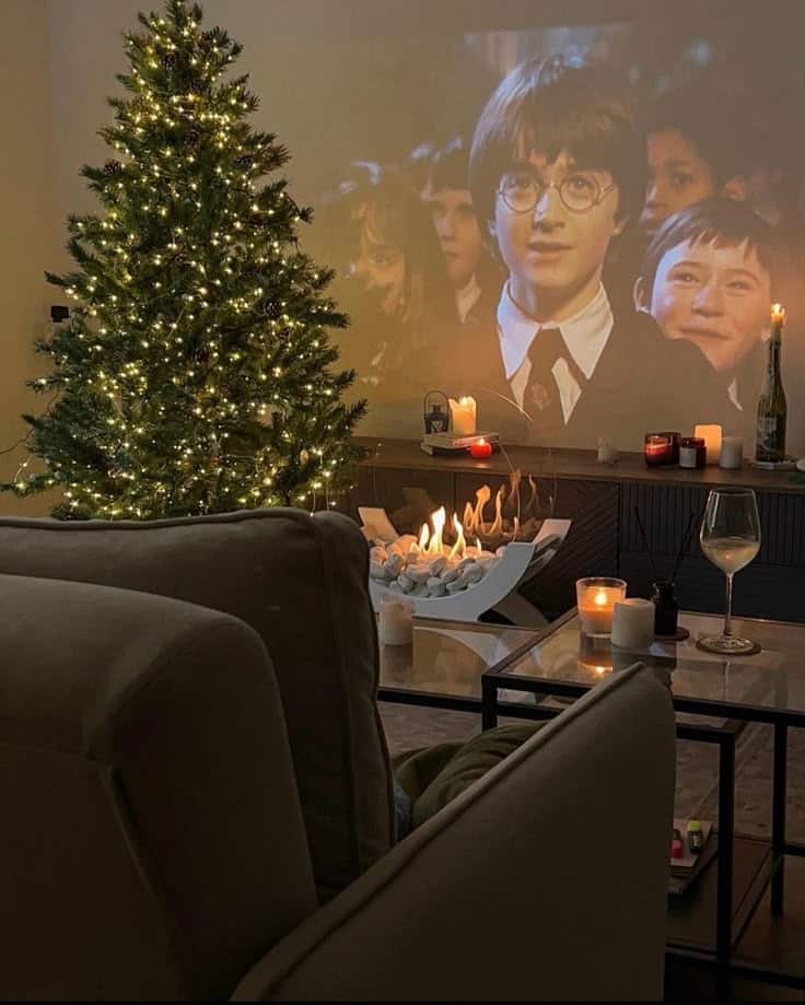 Sindis Amazon Page - Handy Home Cozy living room with Christmas tree, candles, and a movie projected on the wall for a magical holiday atmosphere.