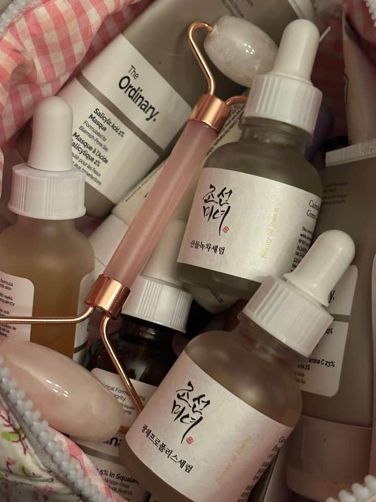 Skincare lover - Handy Home Skincare collection with dropper bottles, face roller, and The Ordinary products in a pink bag.