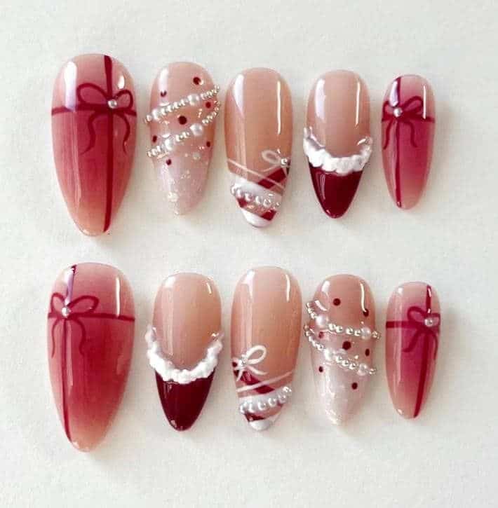 Sweet Christmas Giftbox Bow Press-on Nails Holiday Party Gift Custom Nails - Handy Home Red and beige nail art with bows, pearls, stripes, and dots. Elegant nail design, perfect for special occasions.