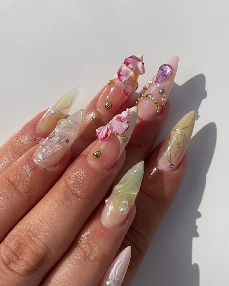 aaea4cb6-aac4-4dd2-bffb-e14ad0721d24 - Handy Home Intricate 3D floral nail art with pearls and crystals, featuring a pink and gold palette on long almond-shaped nails. Perfect for spring.