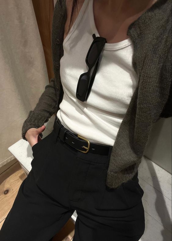 everyday minimal outfit - Handy Home Casual outfit with a white tank top, black pants, and a cardigan. Sunglasses tucked in the top for a stylish touch.