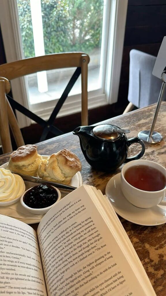 scones tea great book rainy sunday 💕🥰🫶✨🌸☂️ - Handy Home Cozy café scene with tea, scones, cream, jam, and a book by the window, perfect for a relaxing dessert break.