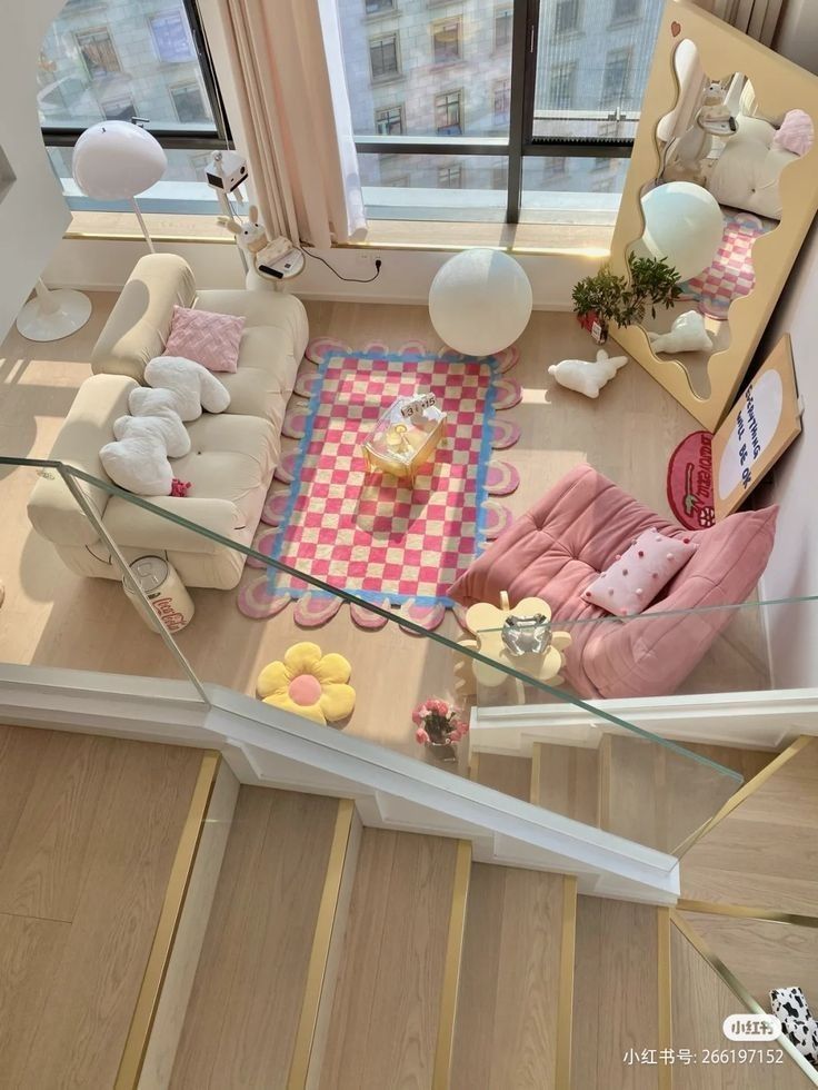 Cozy, chic living room with pink and cream decor, checkered rug, and large window for natural light. Perfect for relaxation.
