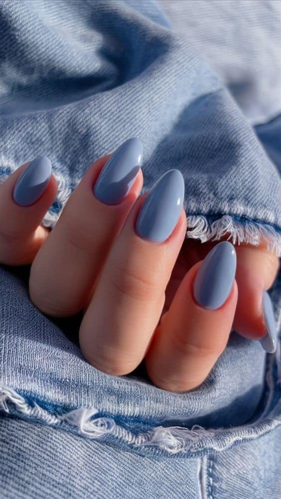 031aced1-1ba2-498e-a024-730a9756117f Stylish blue polished nails against frayed denim, showcasing trendy nail art and fashion-forward style. - Handy Home Stylish blue polished nails against frayed denim, showcasing trendy nail art and fashion-forward style.