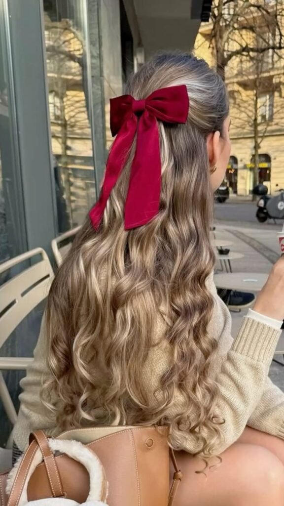 Screenshot Long, wavy hair styled with a red bow, sitting outside with a coffee on a sunny day. Cozy sweater and handbag visible. - Handy Home Long, wavy hair styled with a red bow, sitting outside with a coffee on a sunny day. Cozy sweater and handbag visible.