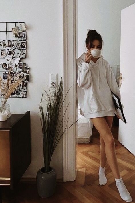 Cozy Aesthetic Home Photo Cozy morning at home: person in oversized hoodie drinking coffee, surrounded by decor and photos, capturing a relaxed vibe. - Handy Home Cozy morning at home: person in oversized hoodie drinking coffee, surrounded by decor and photos, capturing a relaxed vibe.