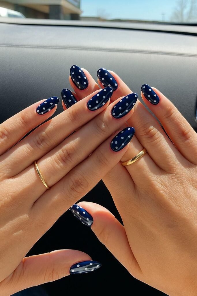 Elegant Navy Blue Polka Dot Press on Nails Blue polka dot nail art on oval nails, hands with gold rings, car interior background. Fashionable manicure design. - Handy Home Blue polka dot nail art on oval nails, hands with gold rings, car interior background. Fashionable manicure design.