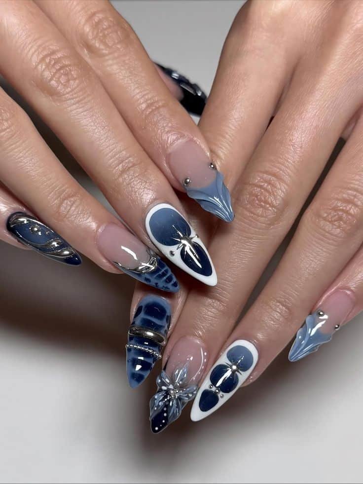 Luxury Blue Chrome 3D Press On Nails Icy Metallic Stiletto Nails 3D Flower Nail Art Christmas New Year Nail Gift for Her Reusable Nails Elegant blue and silver nail art design with intricate patterns and embellishments on long, pointed nails, perfect for a chic look. - Handy Home Elegant blue and silver nail art design with intricate patterns and embellishments on long, pointed nails, perfect for a chic look.