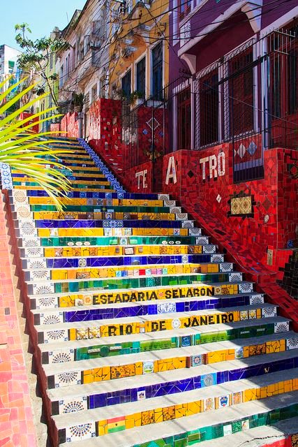 Colorful Selarón Steps with vibrant tiles in Rio de Janeiro, Brazil, featuring eclectic designs in a sunny urban setting.