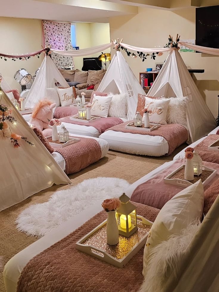 Still cant get over this Dreamee rose-gold Cozy indoor sleepover setup with mini tents, pink bedding, lanterns, and pillows in a warmly lit room. - Handy Home Cozy indoor sleepover setup with mini tents, pink bedding, lanterns, and pillows in a warmly lit room.