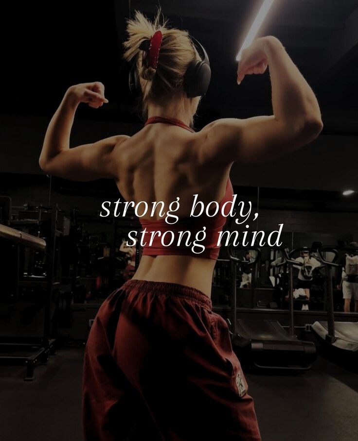 Strong Body Strong Mind_ Empower Your Fitness Journey A woman flexes her muscles in a gym, showcasing strength and fitness. Text overlay: Strong body, strong mind. - Handy Home A woman flexes her muscles in a gym, showcasing strength and fitness. Text overlay: Strong body, strong mind.