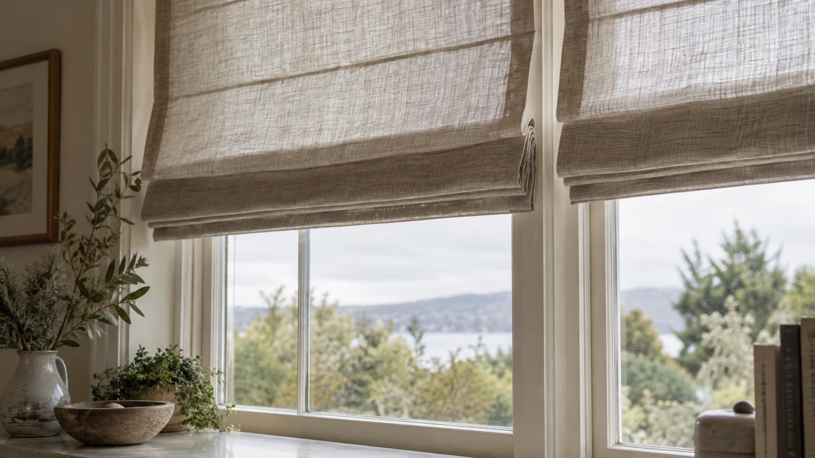 Combine Style and Function With roman blinds sydney Close interior view of tailored Roman blinds with visible fabric weave framing a bright window - Handy Home Close interior view of tailored Roman blinds with visible fabric weave framing a bright window